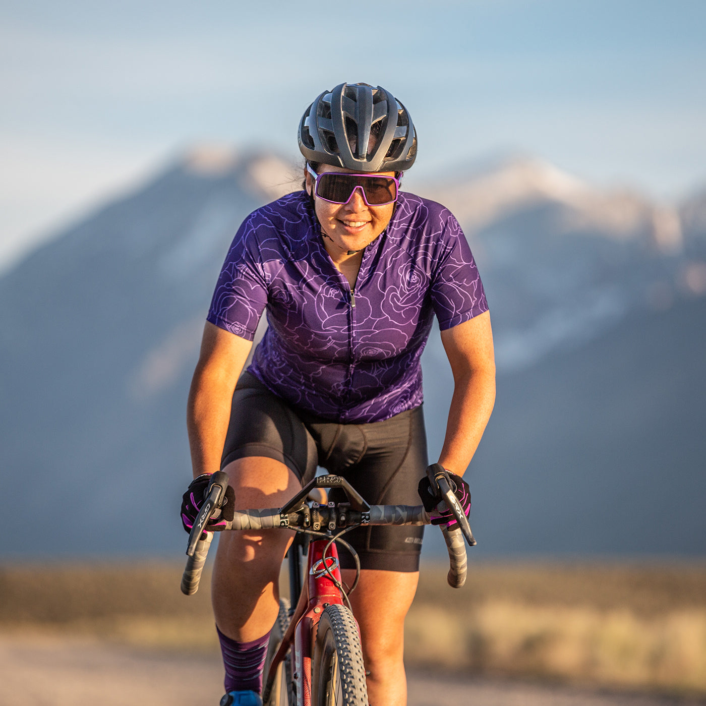 female gravel cyclist wearing purple motion jersey