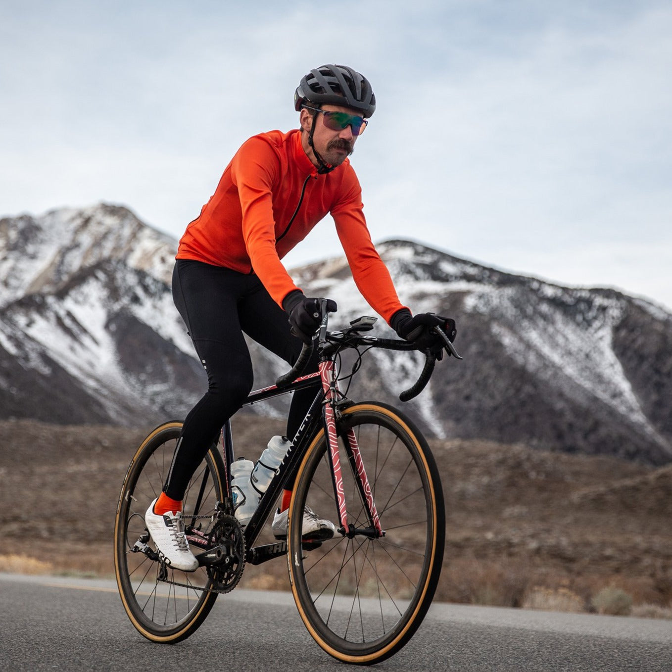 Male cyclist wearing long sleeve thermal jersey and winter tights in California Sierra;s